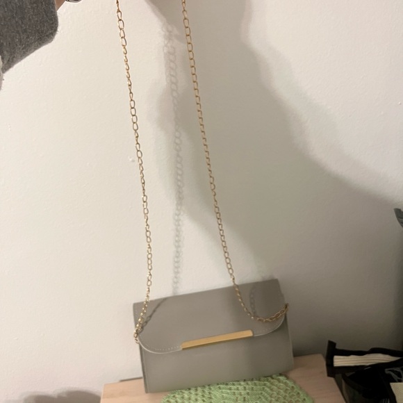 Non Brand Gray Crossbody, never used, smoke free home. Comes with a dust bag. - Picture 3 of 6